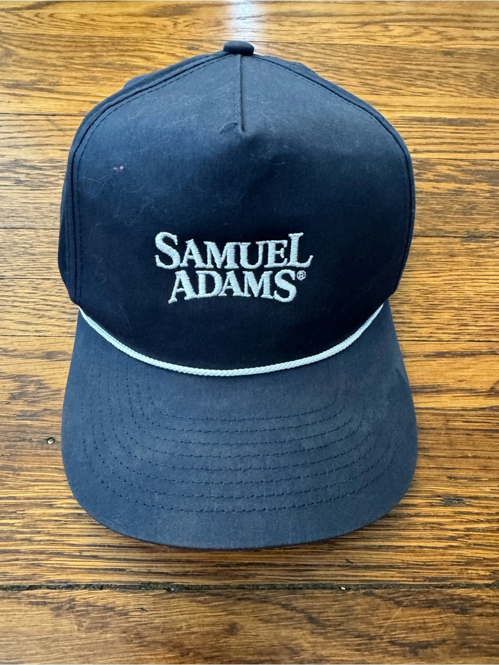 Samuel Adams brewery cap. With rope across brim